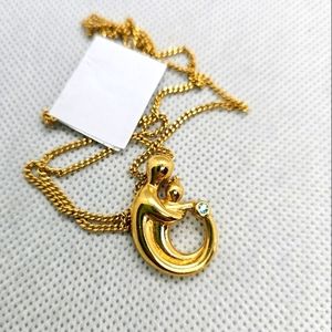 Goldtone Mother holding child with December Birthstone Fashion Necklace